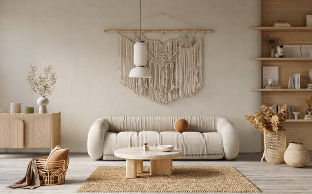 Boho-style living room with neutral sofa, wooden coffee table, woven rug, and wall hanging decor.